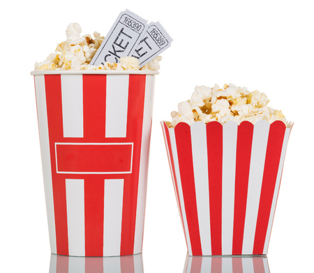 Two large striped boxes filled with popcorn and movie tickets gray on a white background.の写真素材