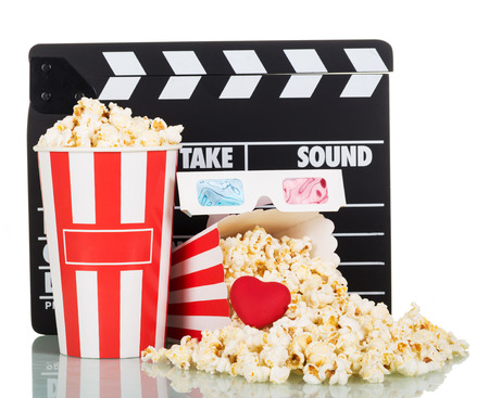 Popcorn in boxes and spilled, party poppers, 3D glasses, red heart, isolated on white background.の写真素材