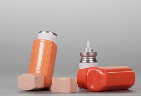 Device for inhalation with a dispenser on gray backgroundの写真素材