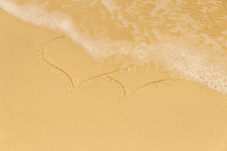 Two painted hearts washed off sea foamの写真素材