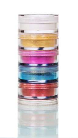 Jars with bright eye shadow isolated on white background.の写真素材