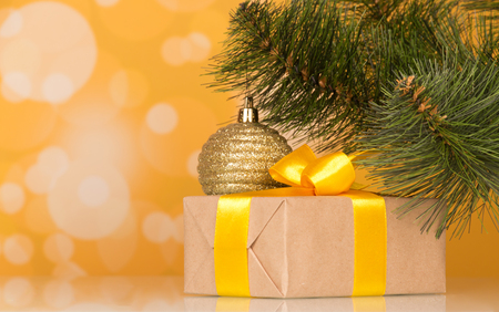 New Year's accessories and gift in box on yellow sparkling backgroundの写真素材