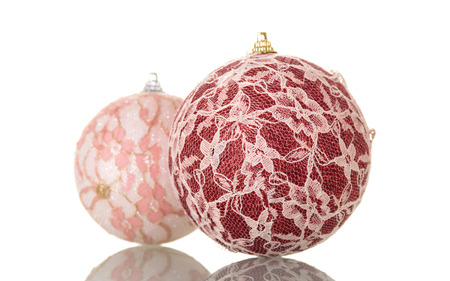 Big red ball and pink, decorated with lace, isolated on white backgroundの写真素材