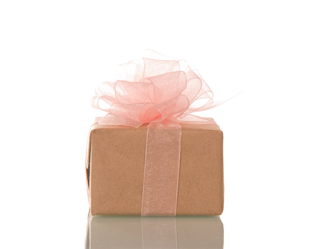 Small gift box with pink bow isolated on white backgroundの写真素材
