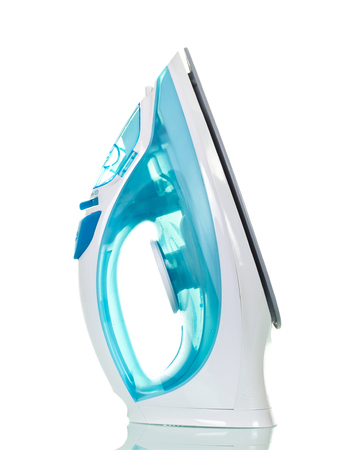 Modern electric iron with spray, isolated on white backgroundの写真素材