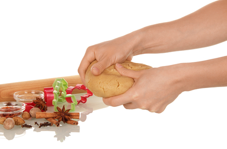 Hands of woman kneading dough, isolated on white backgroundの写真素材