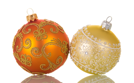 Two bright multicolored Christmas toys, decorated with patterns, isolated on white backgroundの写真素材