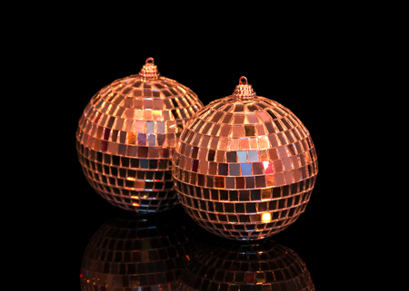 Charming new year toys with mirror surface isolated on black backgroundの写真素材