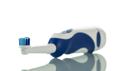 Electronic ultrasonic toothbrush, lying isolated on white backgroundの写真素材