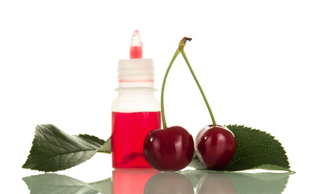 Bottle of liquid for smoking with cherry aroma isolated on white backgroundの写真素材