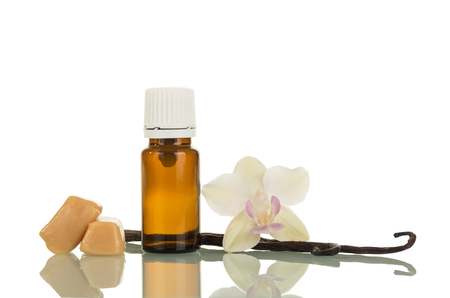 Bottle of fragrante liquid for smoking, vanilla pod isolated on white backgroundの写真素材