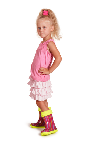 Girl in rubber boots isolated on white backgroundの写真素材