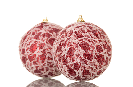 Two Christmas balls decorated with lace isolated on white backgroundの写真素材