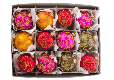 Set of Christmas toys packed in box with cells isolated on white backgroundの写真素材
