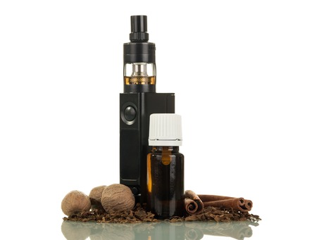 Electronic cigarette, liquid for smoking, fragrant spices isolated on white backgroundの写真素材