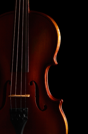 Violin with ragged string, isolated on black backgroundの写真素材