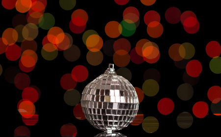 Mirror christmas ball, close-up on dark shimmering backgroundの写真素材