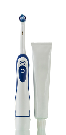 Electric device for the care of mouth and tooth paste, isolated on white backgroundの写真素材