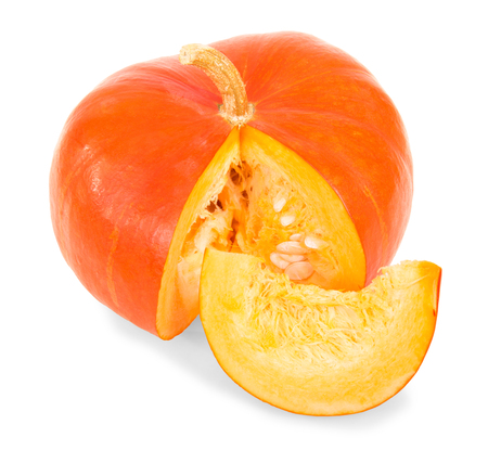 Ripe, juicy pumpkin, near slice isolated on whiteの写真素材