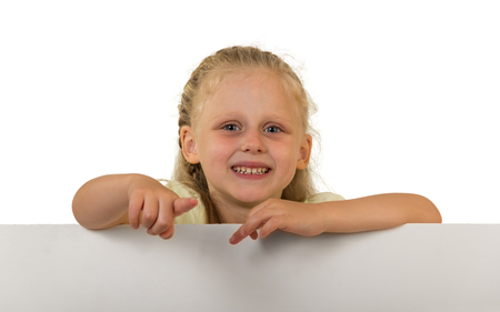 Little girl with a beautiful hairstyle holding a banner, isolated on whiteの写真素材