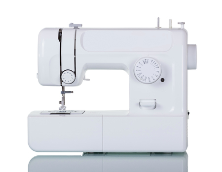 Modern multi-functional household sewing machine isolated on whiteの写真素材
