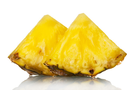 Juicy pineapple pieces isolated on white. Closeupの写真素材
