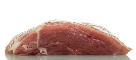 Big piece of fresh pork isolated on whiteの写真素材