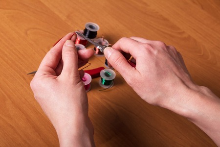 Tool and set of multicolored wire for jewelry making, on table