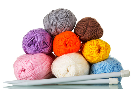 Skeins of yarn of different colors, textures and sizes, knitting needles, isolated on whiteの写真素材