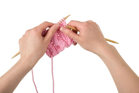 Hand made, hand craftswoman behind knitting, isolated on white backgroundの写真素材