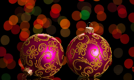 Two bright pink Christmas ball with patterns, on dark backgroundの写真素材