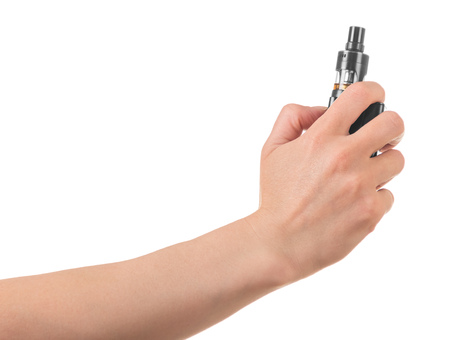 Electronic cigarette for vaping in womans hand isolated on whiteの写真素材