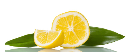 Juicy ripe lemon slices with green leaves isolated on whiteの写真素材