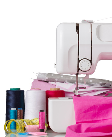 Electric sewing machine, cloth and accessories on greyの写真素材