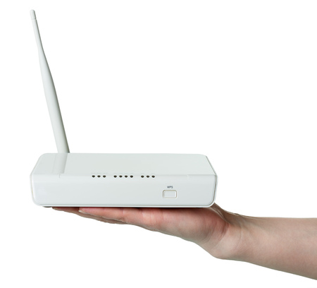 Wi-Fi router with WPS technology on female hand, isolated on whiteの写真素材