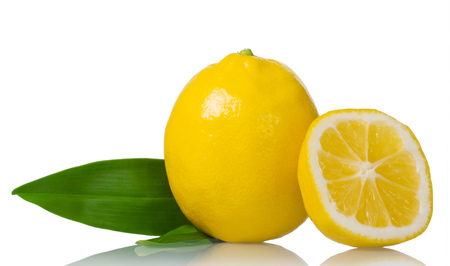 Whole lemon with leaf and half isolated on whiteの写真素材
