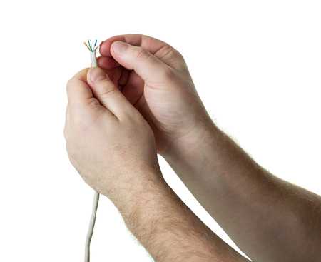 Human hands with Optic fiber cable, isolated on whiteの写真素材