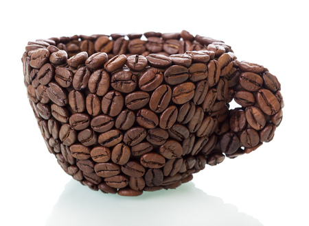 Improvised Cup made of coffee beans isolated on whiteの写真素材
