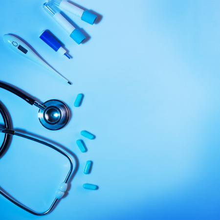Medical instruments for diagnosis and medicines drugs, on blue backgroundの写真素材
