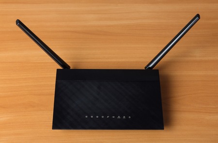 Wi-Fi router to connect multiple devices to local Internet, on tableの写真素材