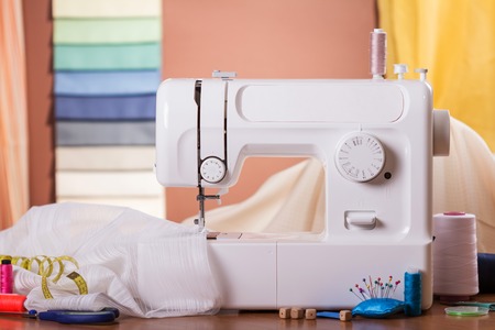 Sewing machine and fabric in work, near sewing accessoriesの写真素材