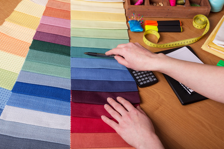 Sewing accessories, fabric samples on tableの写真素材