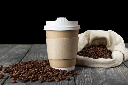 Coffee beans in bag and on table, a special Cup for coffeeの写真素材