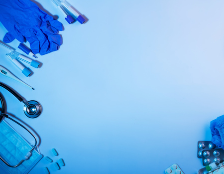 Diagnostic and first aid items, laid out on blue backgroundの写真素材