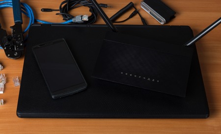 Modern digital communication devices, tools for connection, on tableの写真素材