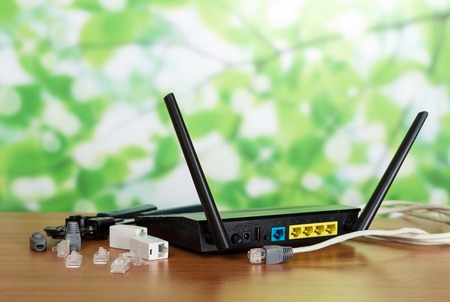 Router panel for connection, connectors and adapters, cable on green backgroundの写真素材