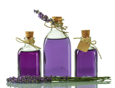 Bottles with lavender tincture, closed with corks isolated on whiteの写真素材