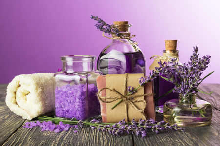 Components for relaxation, towel and twigs of lavender on purpleの写真素材