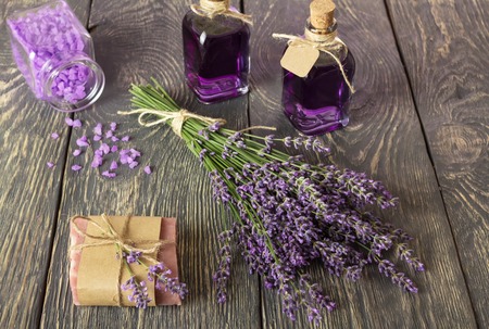 Handmade soap, lavender tincture, sea salt, on tableの写真素材