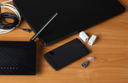 Modern equipment and router, components for Internet connection, on desktopの写真素材